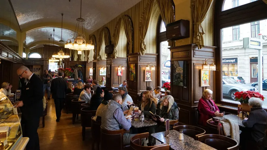 Interior of Cafe Schwarzenberg, one of Vienna's famous coffeehouses.