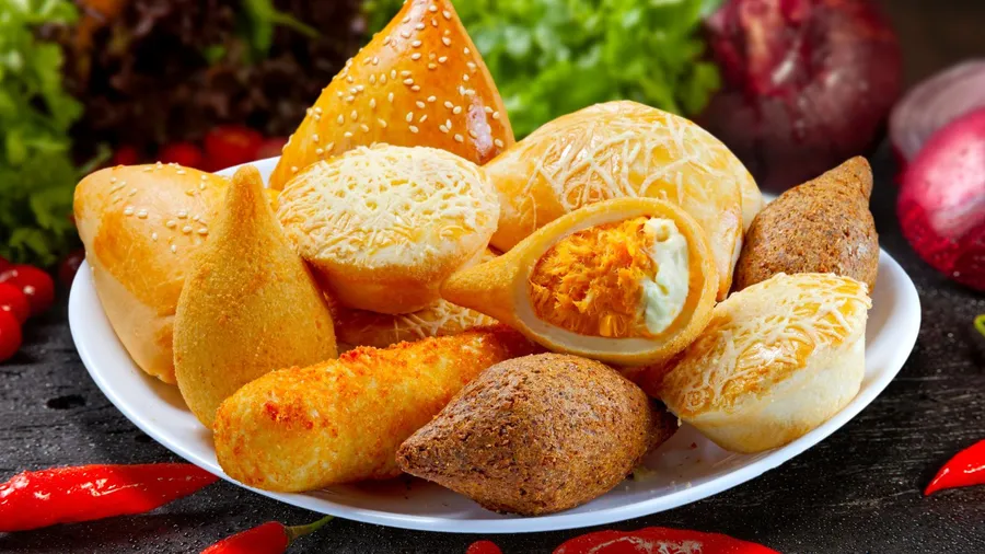 Brazilian snacks, esfirra, kebab, patty, coxinha, sausage wrapped. rocharibeiro