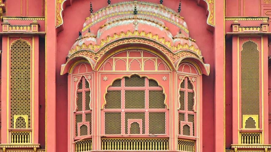 A close-up view of a pink and gold ornate domed architectural structure, likely part of a historic building or palace.