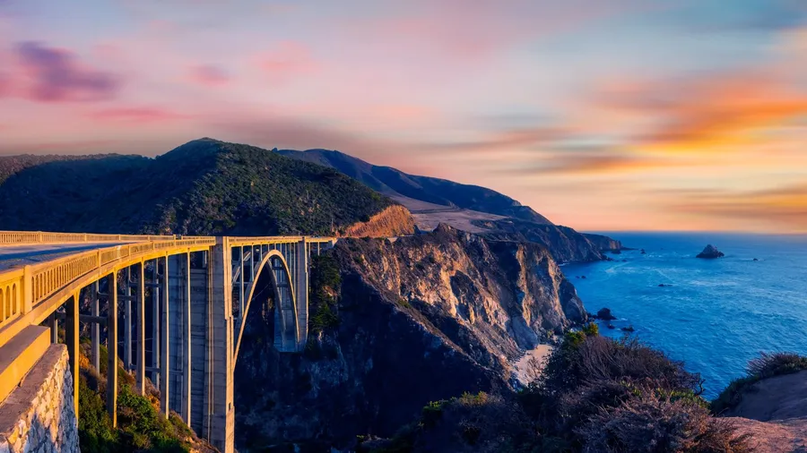 Bixby Bridge (Rocky Creek Bridge) and Pacific Coast Highway at sunset near Big Sur in California, USA.