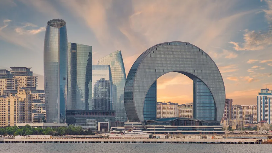 The modern Crescent Hotel in Baku, Azerbaijan, featuring a distinctive crescent-shaped design.