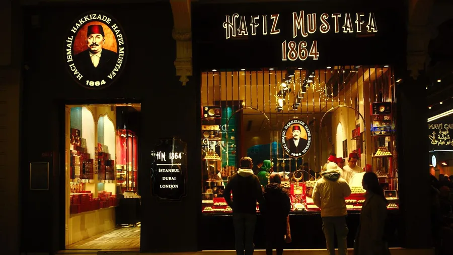 The front view of Hafiz Mustafa 1864 shop at night.