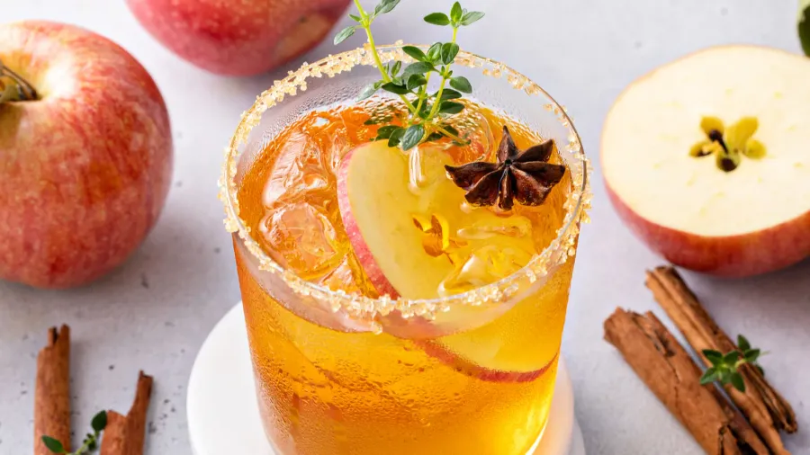 Apple cider margarita with brown sugar rim, cinnamon and fresh thyme, fall cocktail or mocktail idea