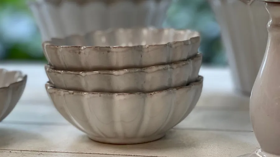 Stacked ceramic bowls in a subtle tone.