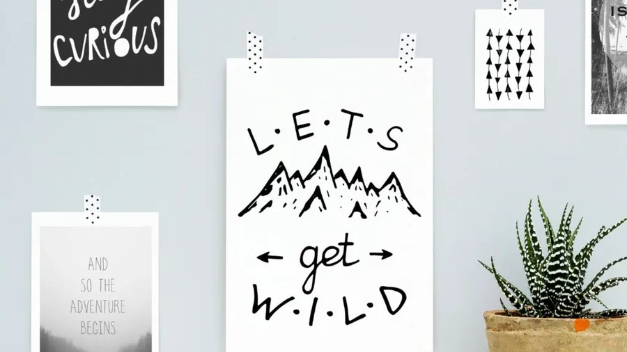 Gallery wall featuring motivational quotes and design elements with a plant.