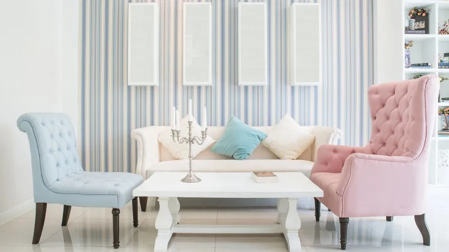 A stylish living room with colorful chairs and elegant decor.