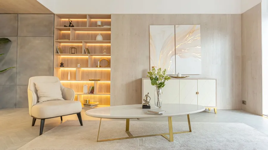 Elegant shelving unit with warm lighting, decorated with various items in a contemporary living space. built-in elements