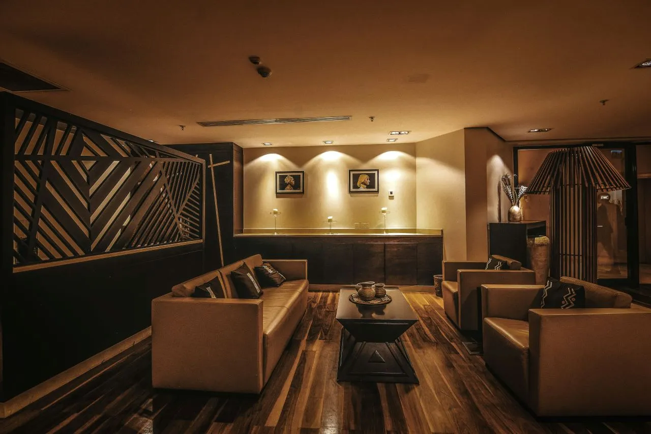 Enhance your living room's ambiance by incorporating layered lighting.