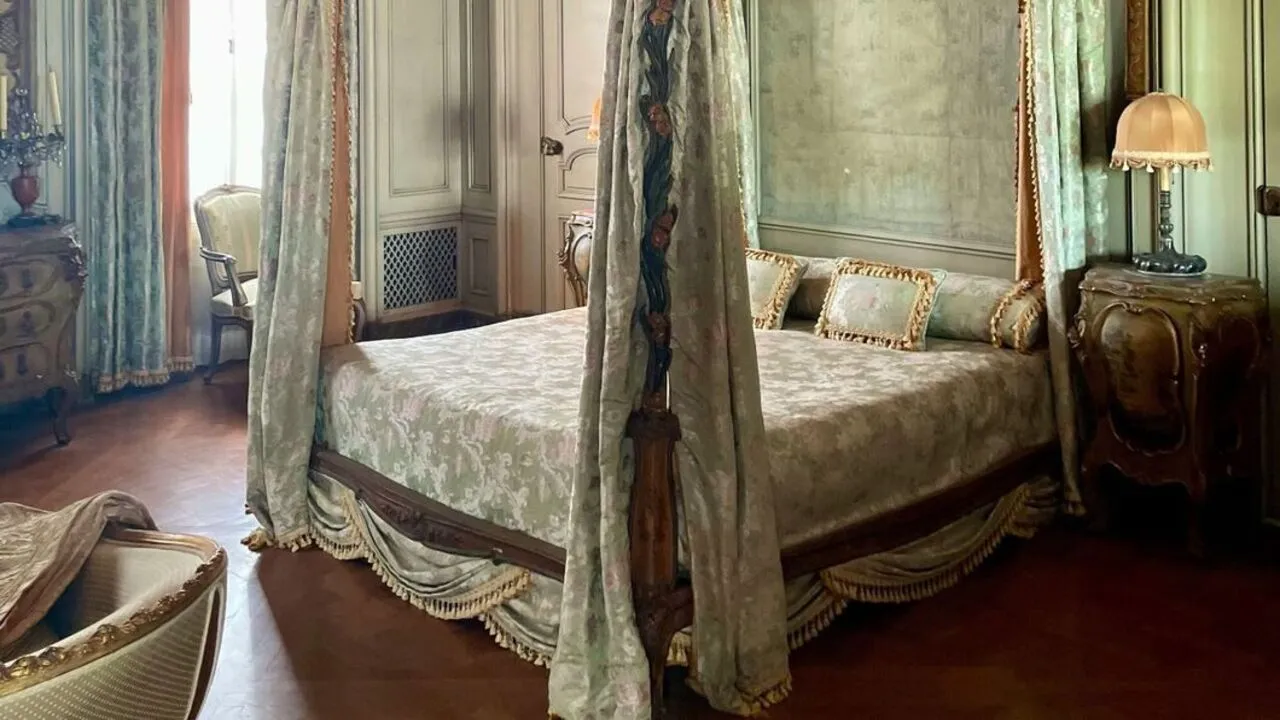 A canopied bed exudes luxury and romance in the bedroom.