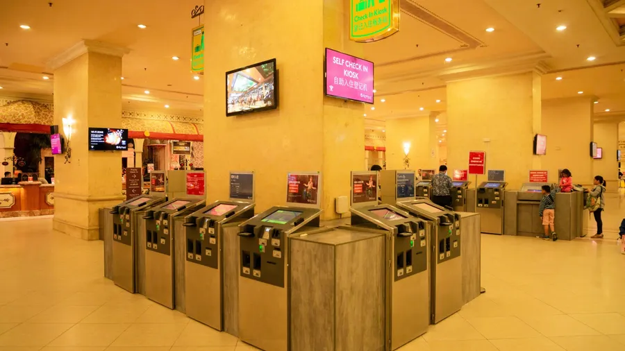 Genting , Malaysia - Mar 1, 2019 : close up many kiosks , tourist check in by kiosk in first world resort at genting highland in Malaysia .