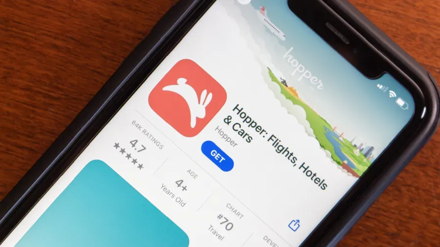Vancouver, CANADA - Apr 16 2024 : Hopper app seen in the App Store on an iPhone. The Hopper app is a travel booking platform to help users find the best deals on flights, hotels, and car rentals
