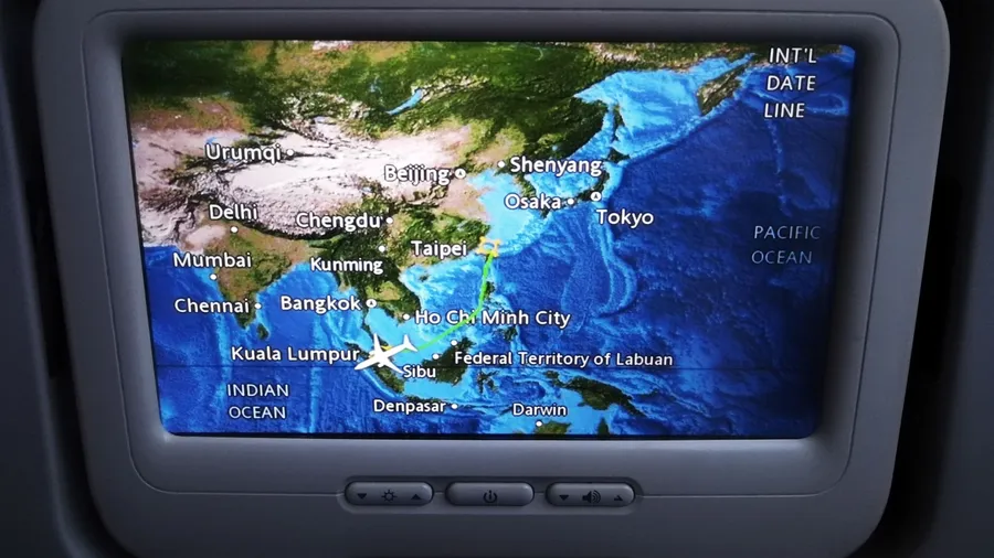 Journey of the air craft being shown on the LCD monitor installed behind the headrest of the airplane seat.