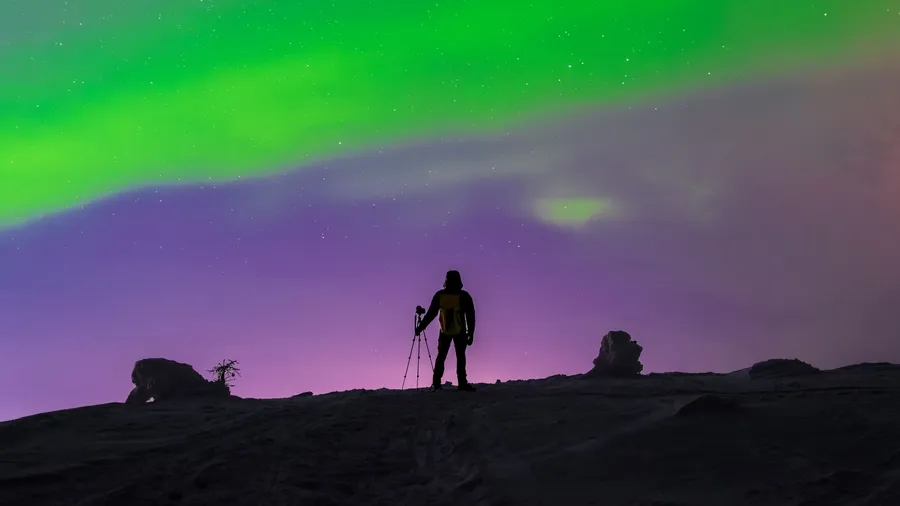 "The Photographer" Northern lights (Aurora Borealis) in Khibiny Mountains, Murmansk region, Russia, Far North, Polar Night