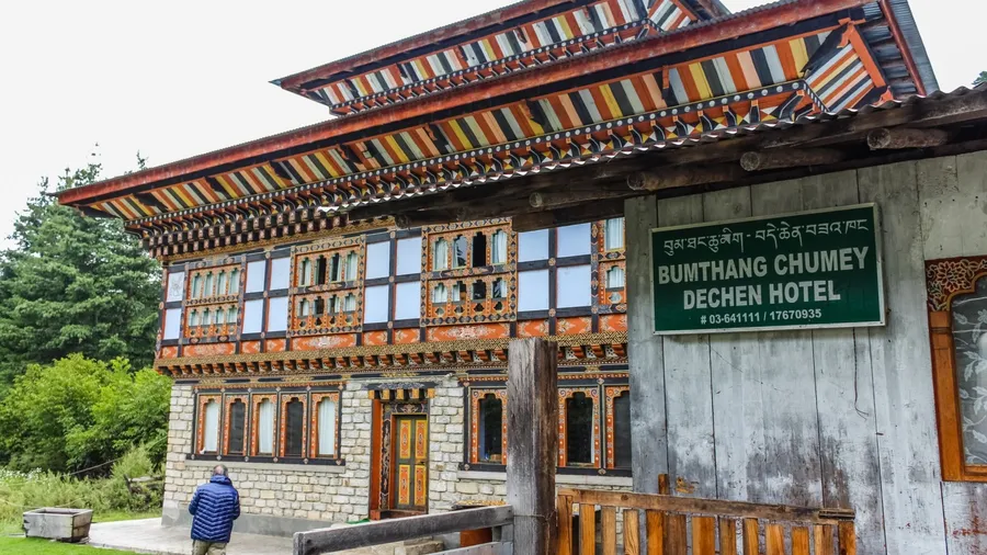 Bumthang, Bhutan - September 13, 2016: Bumthang Chumey Dechen Hotel in Bumthang, Bhutan. Man walking in the garden.