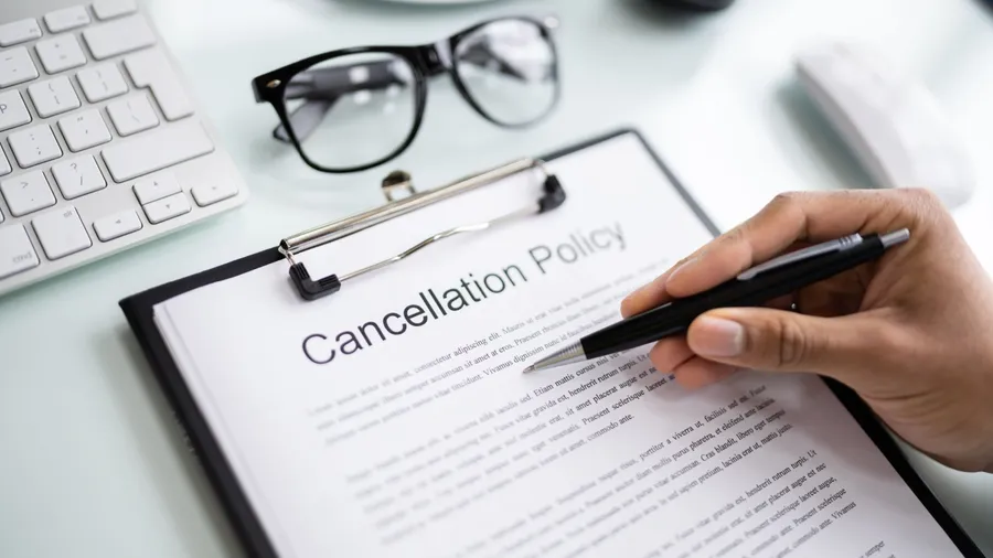 African Man Reading Business Cancel Policy And Regulation