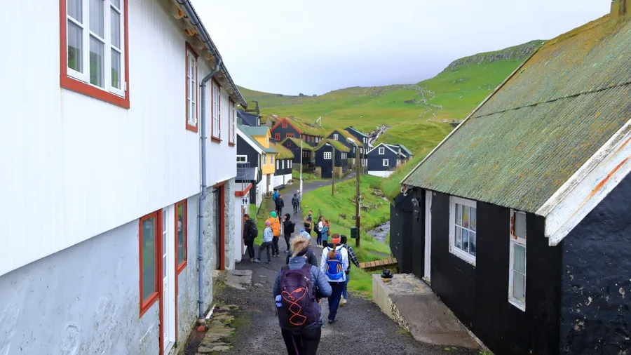 Mykines island, Faroe Islands, Denmark in Europe - August 25 2025: people enjoy the beautiful village and island of Mykines