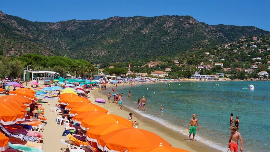 LE LAVANDOU, FRANCE -25 JULY 2015- The Saint Clair beach in Le Lavandou, a resort town on the French Riviera in the departement of Var in Southern France on the Mediterranean Sea.
