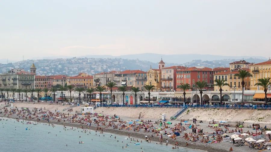 Nice/France-August 3, 2018 View of Promenade des Anglais Beach at sunset-The most famous stretch of beach in Nice,French riviera.