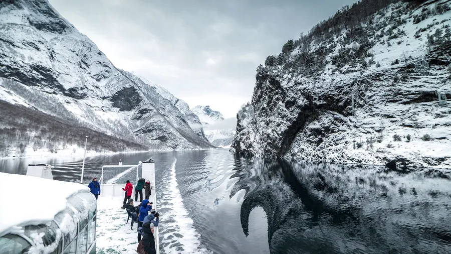 NORWAY- BERGEN - DECEMBER, 28: tourist ferry passes through the famous throughout the world Norwegian fjords, on December 28, 2014. Bergen. Norway