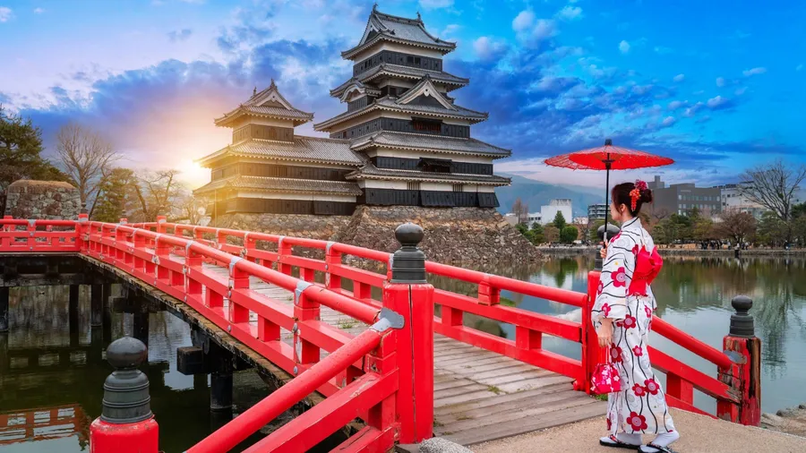 Japanese girl in traditional japanese kimono among Matsumoto Castle is one of the most complete and beautiful among Japan's original castles.