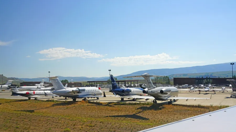 JACKSON HOLE, WY –1 AUG 2020- View private jet planes parked at the Jackson Hole Airport (JAC) in the Grand Teton National Park in Wyoming, United States.