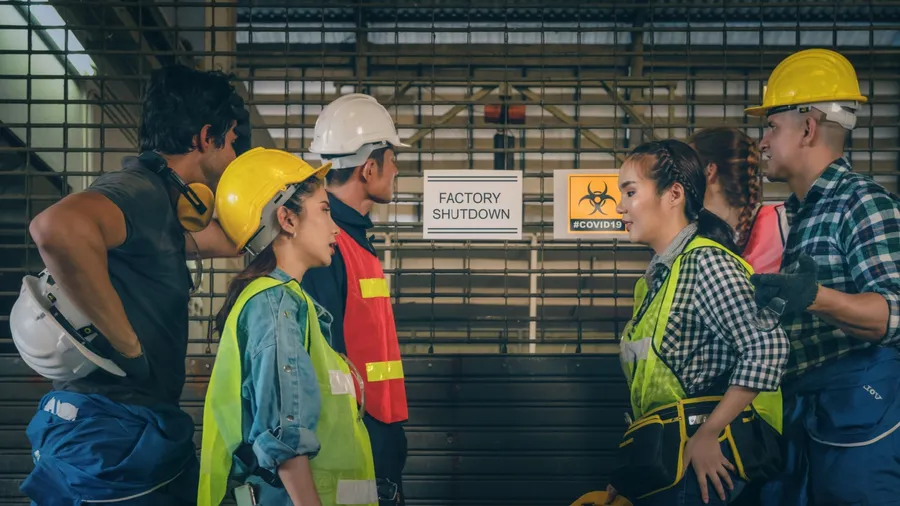 factory workers at factory with layoff annoucement of factory closed due to problem from coronavirus covid 19 outbreak with depressed of job losing and unemployment, problem from coronavirus outbreak
