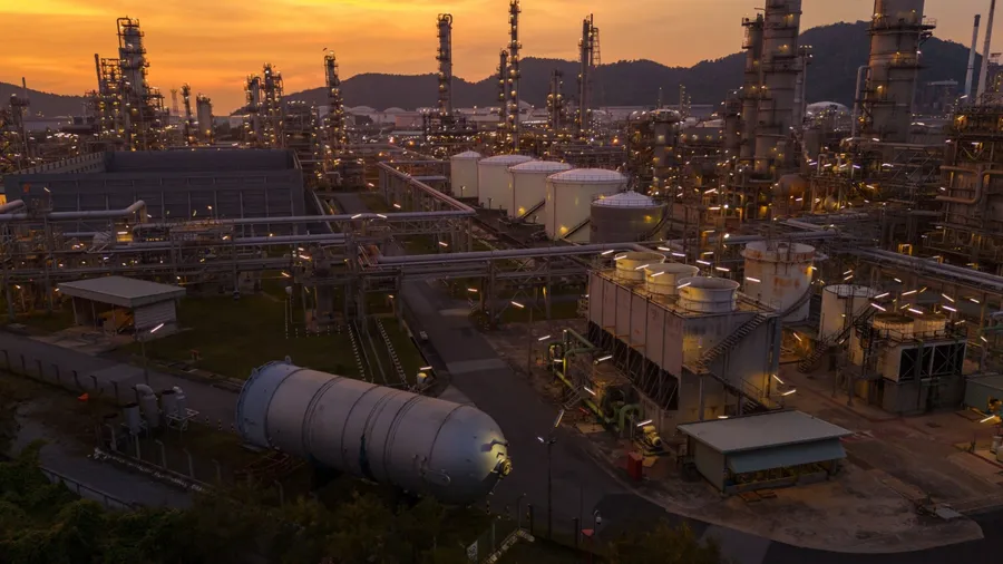 Oil Refinery plant at sunset. Gas Chemical Equipment Prodiction import export Concept, Crude Oil Refinery Plant Steel Pump Pipe line and Chimney and Cooling tower, Chemical Petrochemical