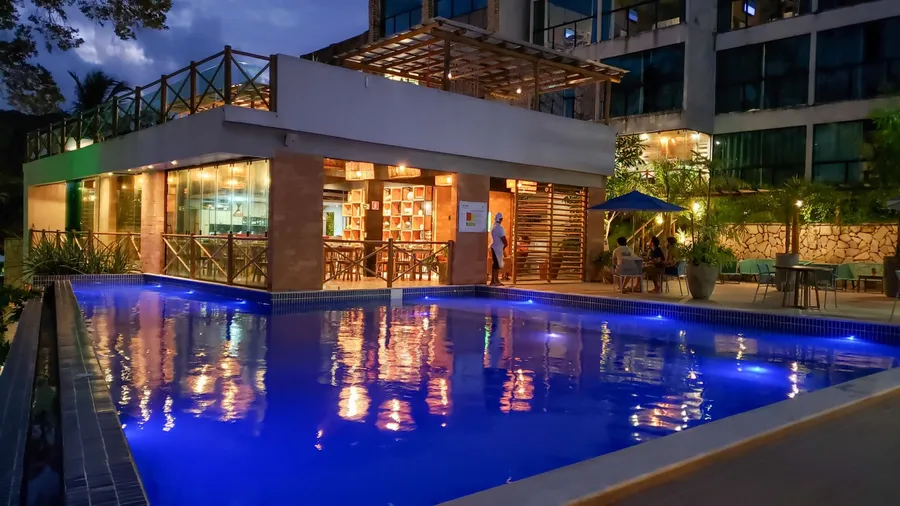 Fancy hotel swimming pool at night. Light reflexes. Japaratinga, AL, Brazil. May 23, 2021.