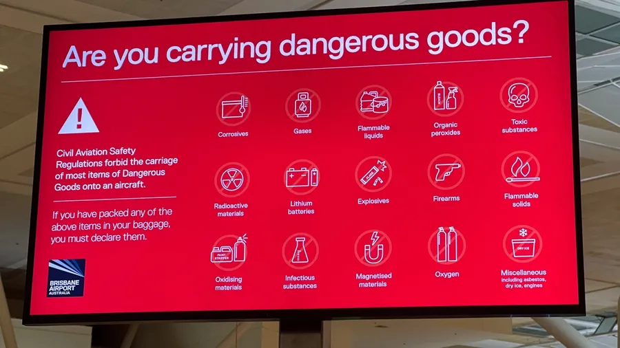 BRISBANE - JAN 29 2025:Are you carrying dangerous good? sign at Brisbane Airport. Dangerous goods can be harmful on an aircraft, flammable, explosive, toxic, or react dangerously with other substances