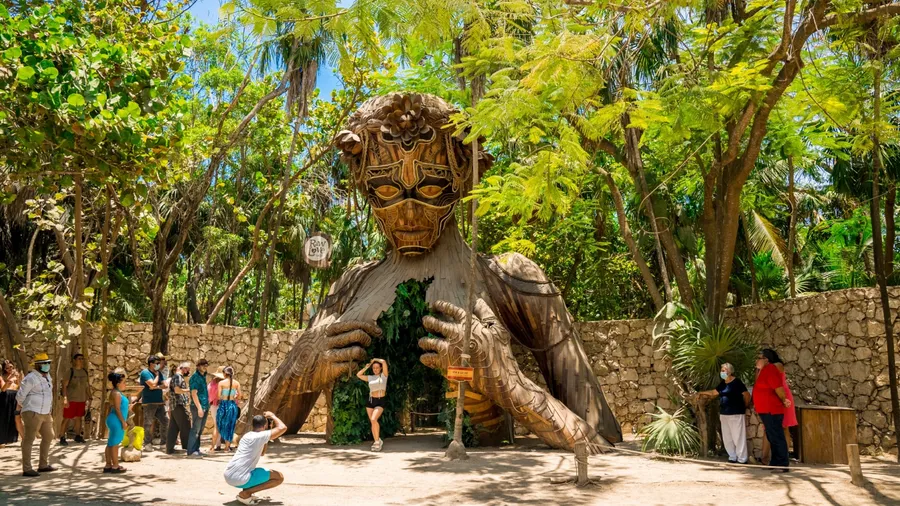 Tulum, Mexico. May 20, 2021.Beautiful towering wooden sculpture called "Ven a La Luz" welcomes guests onto the beach at Ahau Tulum in Mexico.