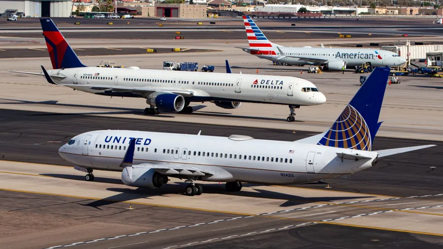 Phoenix, AZ - December 1, 2023: Photo of United, Delta, and American Airlines passenger planes at Phoenix Sky Harbor International Airport (PHX)