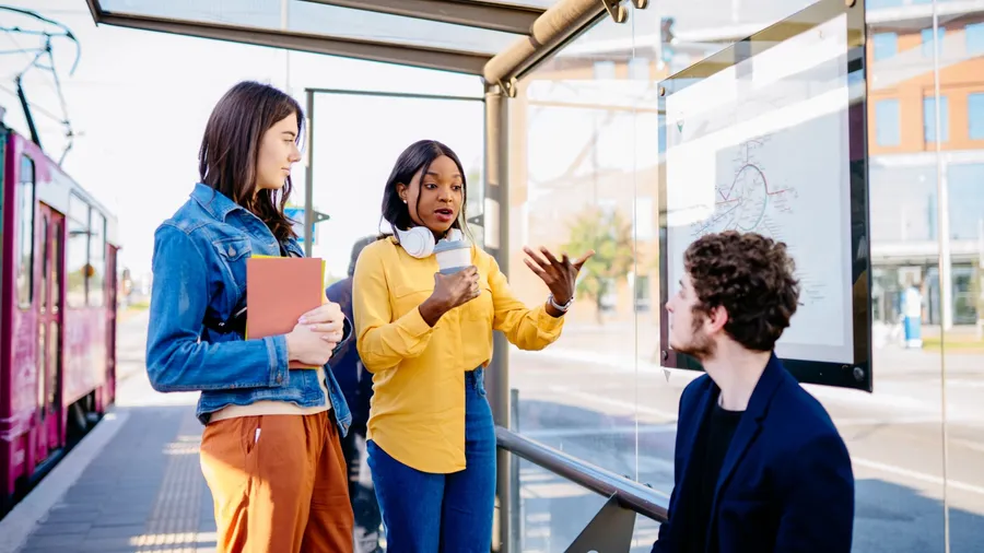 Language barrier concept. How acquaintances with man. Millennials passengers traveling with public transport concept. African woman try to explain, asking for help man.