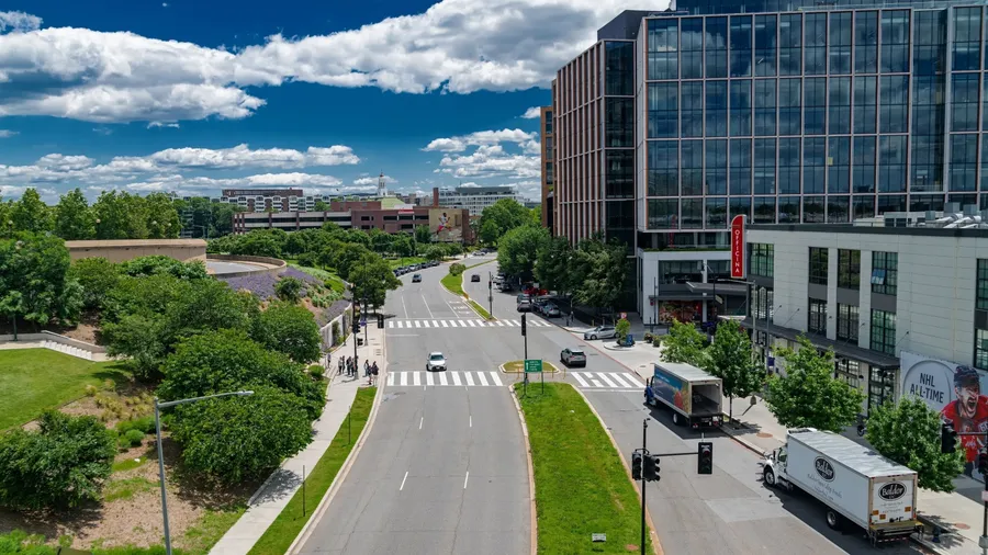 Washington DC, USA, May 31, 2025 Modern architecture in Washington, DC. A vibrant cityscape under a bright blue sky with busy streets and green trees