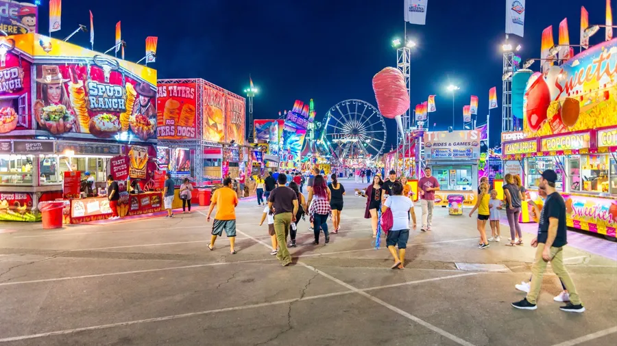 Phoenix, Arizona - October 25, 2017: People throng the midway at the Arizona State Fair during the evening hours.
