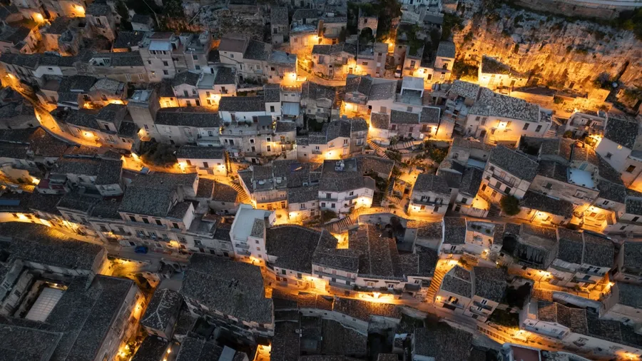 Modica from above – a baroque jewel in Sicily, famous for its chocolate, winding alleys, and breathtaking hillside views. A timeless city best admired from the sky