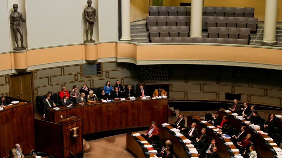 HELSINKI,FINLAND-MARCH 18: Plenary session at Plenary Room of Finnish Parliament, in front of the room sits Government of Finland on March 18, 2010 in Helsinki, Finland