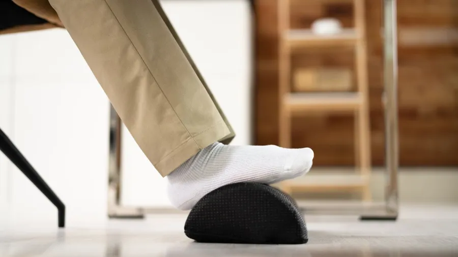 Footrest Against Pain In Office. Shifting Posture And Positions