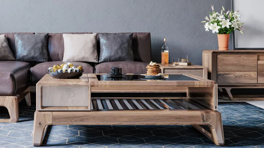 A cozy living room interior with sofa with cushions, a wooden console table, and a reclaimed wood coffee table with pancakes and a cup on it.