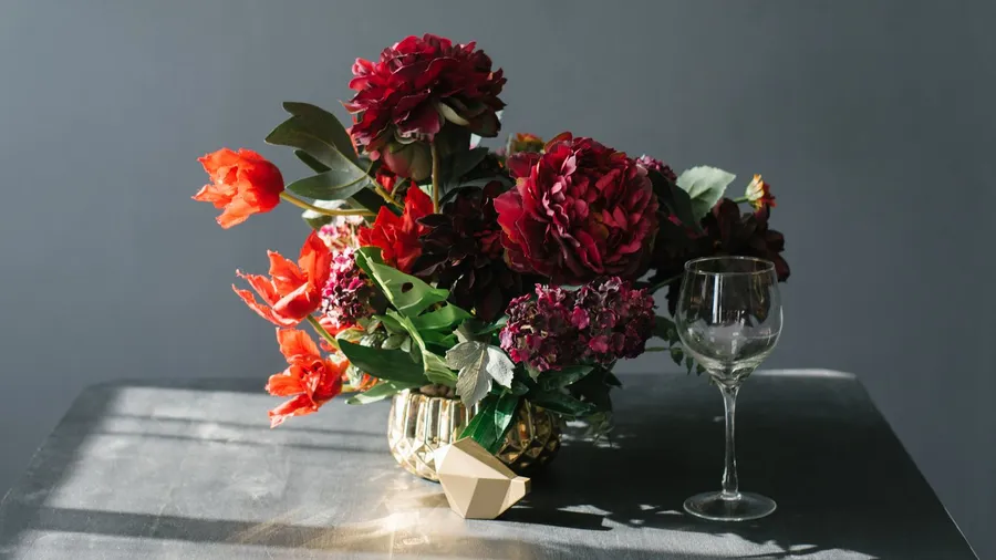 A vase with fresh flowers placed on a table.