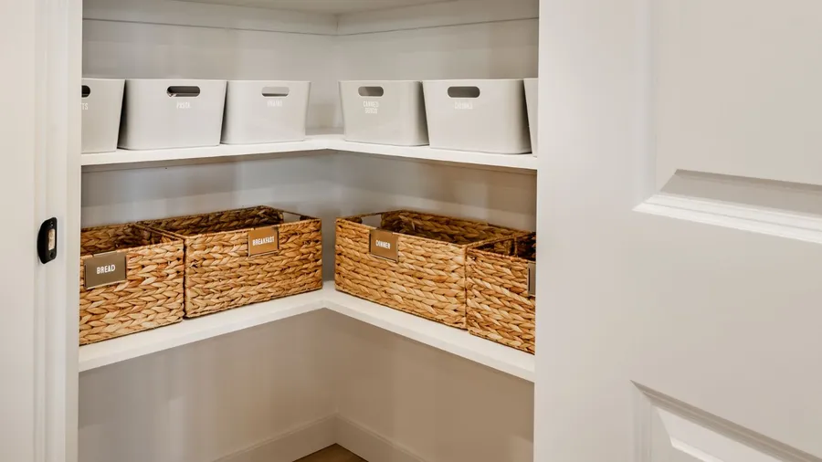 A pantry with labelled baskets.