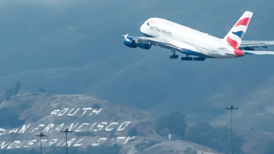 a commercial aircraft departs san francisco international airport on a