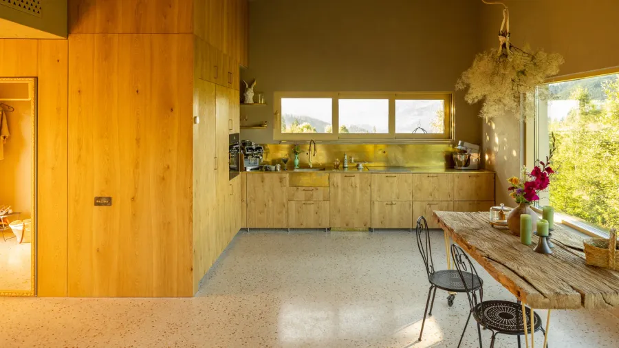 a cozy rustic kitchen with a natural wood design featuring
