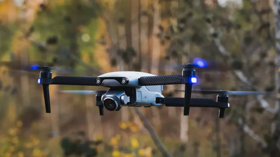a drone with a camera in the air in nature