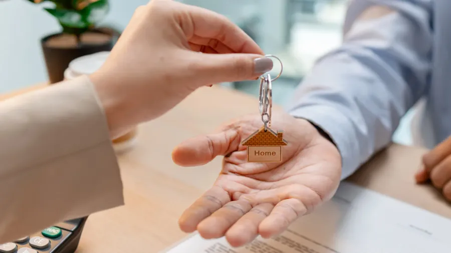 a real estate agent discussing house purchase details with a