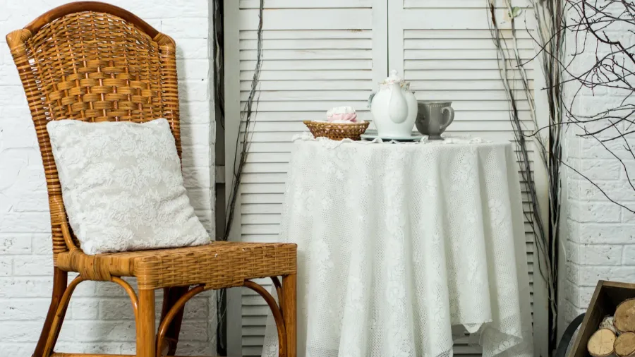 a table covered with thick cloth with a cup of
