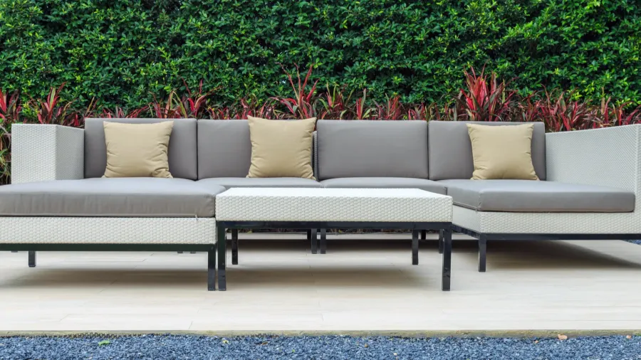 a three brown pillow and gray cushion on a modern