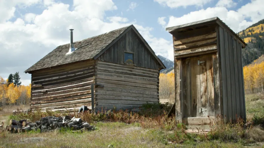 abandoned house and outhouse in colorado ghost town