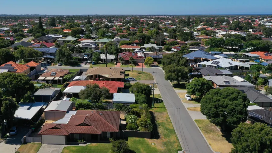 aerial landscape view of a sunny coastal suburb in