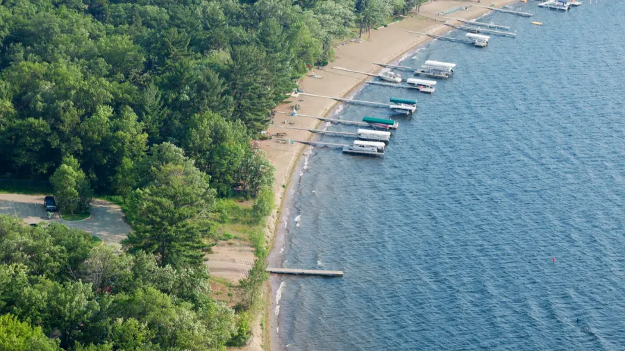 aerial view of lakeshore with docks and boats in minnesota