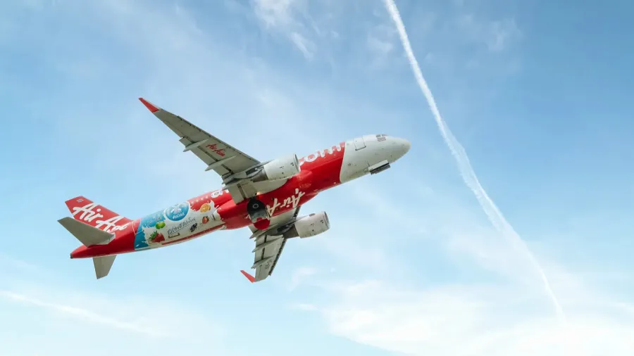air asia airlines boeing 320 flying in the air with